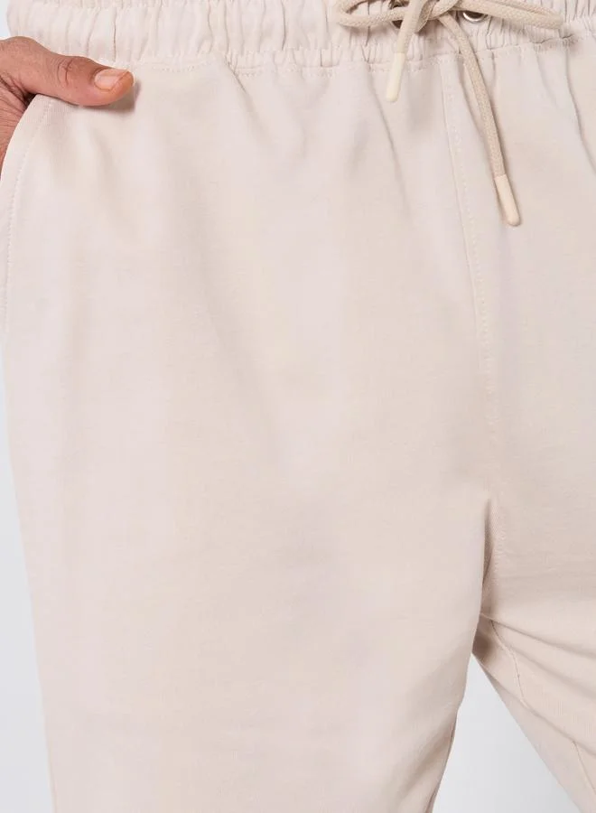 Styli  Men Beige Solid Straight Fit Joggers for Men | Best Price UAE